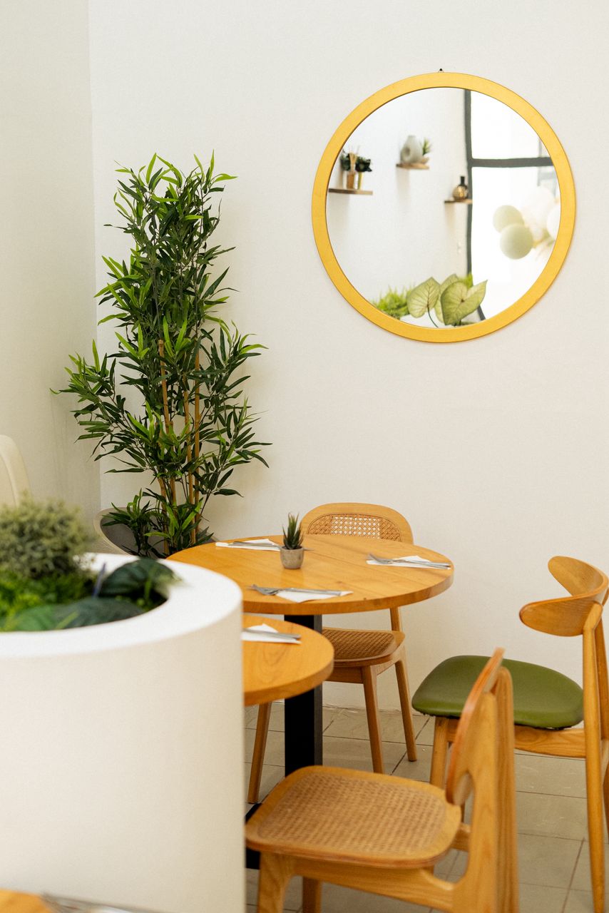 Round mirror corner with table seating inside JKO Brunch